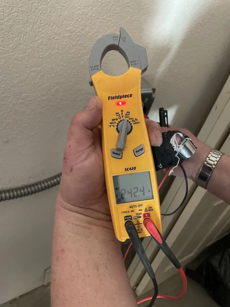 Voltage testing with clamp meter during Ceiling Fan Installation in Eliot